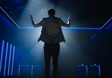 Man speaking at a podium